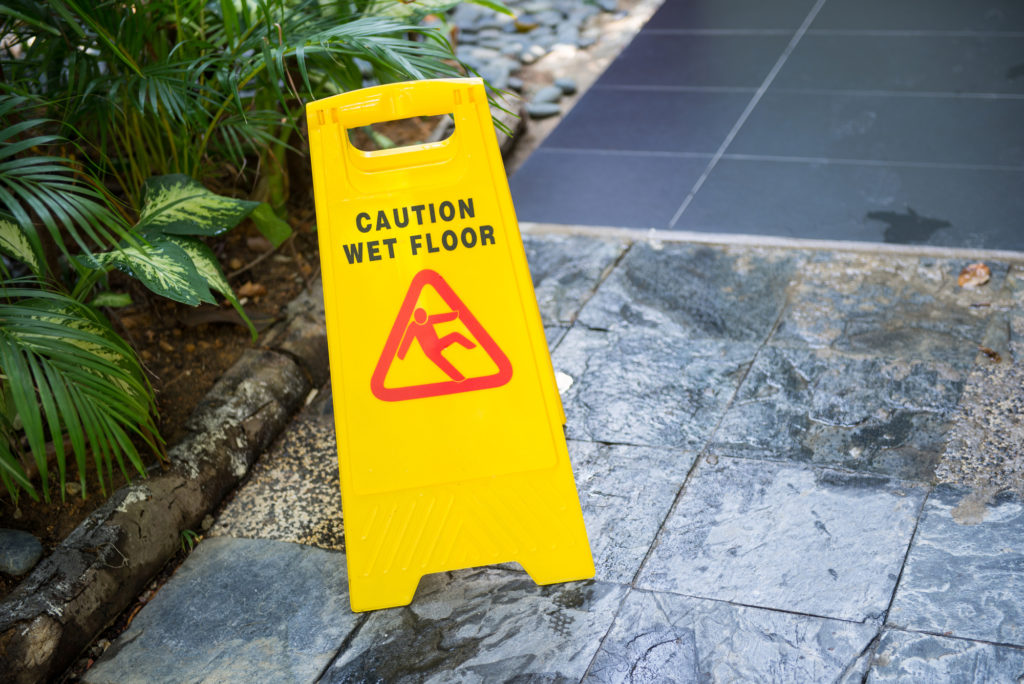 Why An Experienced Lawyer Is Necessary - Sign showing warning of caution wet floor