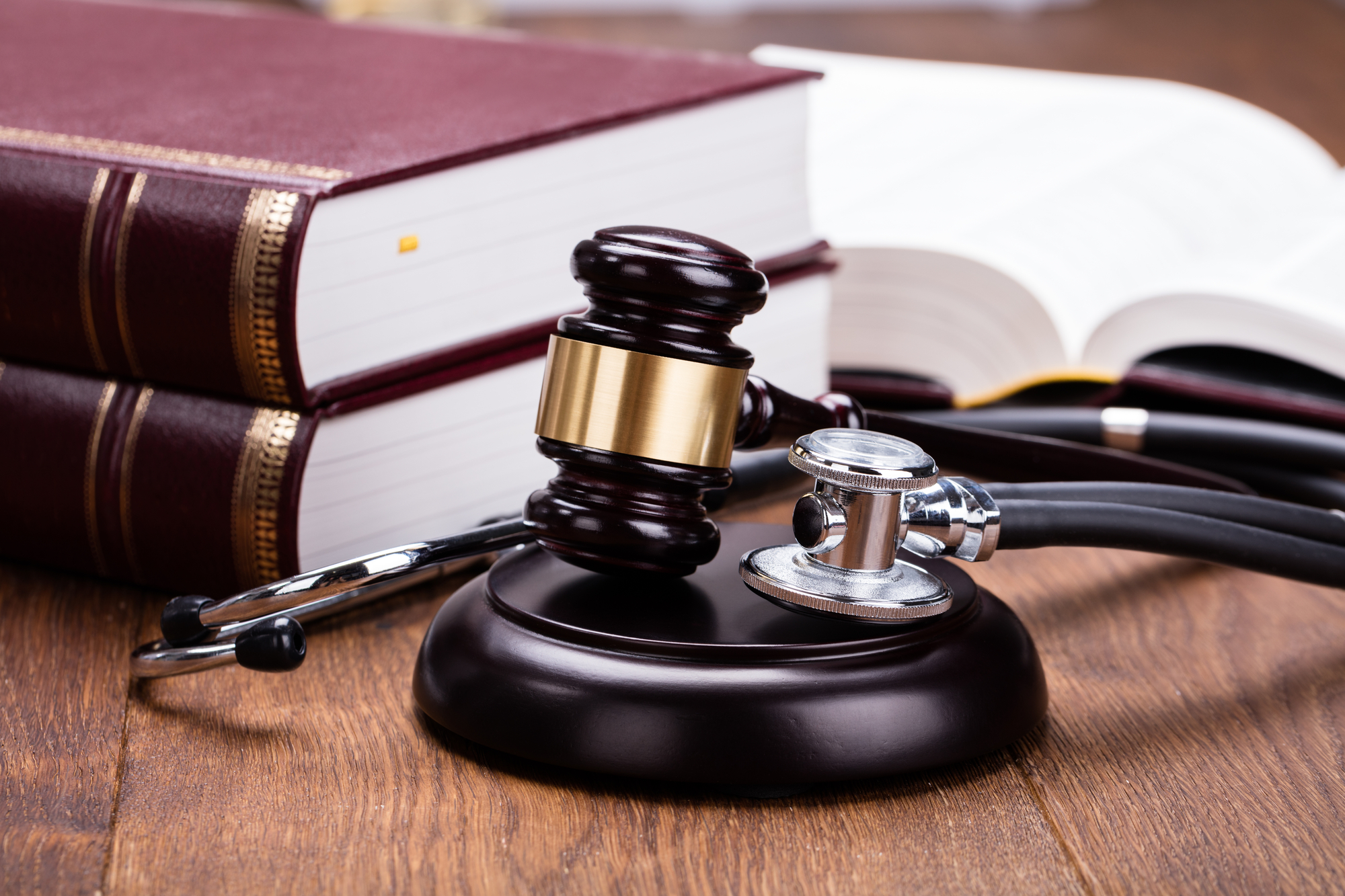 Common Causes Of Medical Malpractice Lawsuits - Gavel With Medical Stethoscope